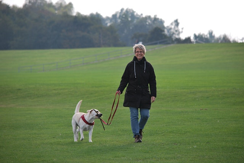 Woman walking dog